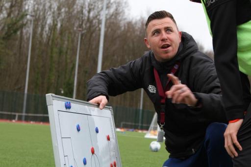 Carl Morris coaching with tactics board